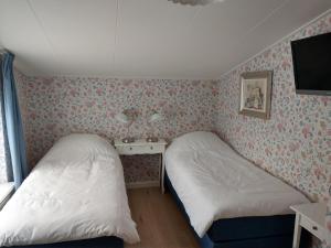 Postel nebo postele na pokoji v ubytování B&B De Blauwe Tulp