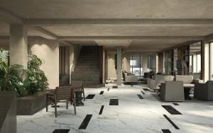 a lobby of a hotel with chairs and tables at Iris Hotel in Siviri