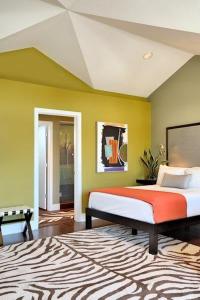 a bedroom with a large bed and a large window at Truman Hotel in Key West