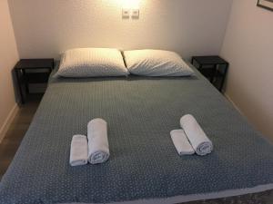 Postelja oz. postelje v sobi nastanitve Kulturist Apartment