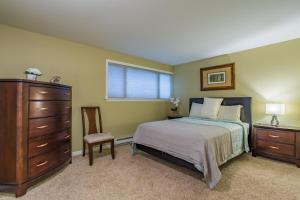 a bedroom with a bed and a dresser and a window at Sea View, Best Area, No Stairs, WD, 2 Bedrooms, Jacuzzi Bath, New Carpet, Balcony, View, 825sf in Tacoma