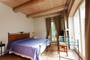Postel nebo postele na pokoji v ubytování Valcastagno Relais & Residence