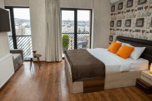 Postel nebo postele na pokoji v ubytování Boutique Hotel