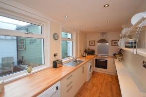 a kitchen with a counter and a sink and a window at Deerness, 4star gold award 2024, Whitby in Whitby