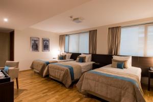 Tempat tidur dalam kamar di Caseros 248 Hotel