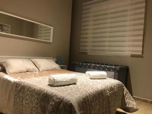 Łóżko lub łóżka w pokoju w obiekcie Apartamento DELUXE Benalmádena