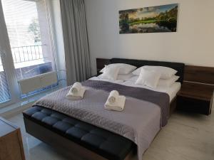 Posteľ alebo postele v izbe v ubytovaní Apartmány Urban