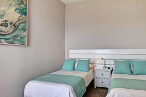 Posteľ alebo postele v izbe v ubytovaní Sonias City Beach