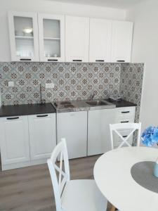 Kuchyň nebo kuchyňský kout v ubytování Apartments Villa Antony