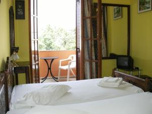 Postel nebo postele na pokoji v ubytování Katerina Hotel