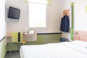 Posteľ alebo postele v izbe v ubytovaní ibis budget Torun