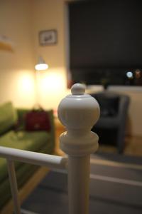 a white pole in front of a living room at Apartment 132 in Sofia +27 photos