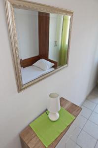 Postel nebo postele na pokoji v ubytování Apartments Zeljko
