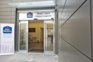 an entrance to a building with a sign for a hospital at Best Western Hotel Luxor in Turin
