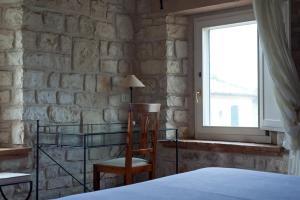 Postel nebo postele na pokoji v ubytování Valcastagno Relais & Residence