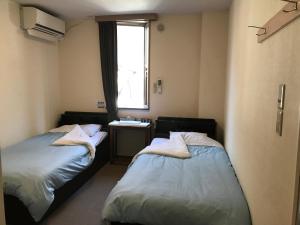 Postel nebo postele na pokoji v ubytování Fujibou Hotel + 74 fotografií