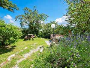 A garden outside Apartment Papavero by Interhome