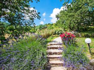 A garden outside Apartment Papavero by Interhome