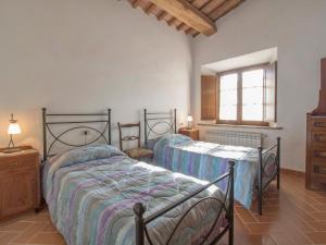 A bed or beds in a room at Apartment Papavero by Interhome