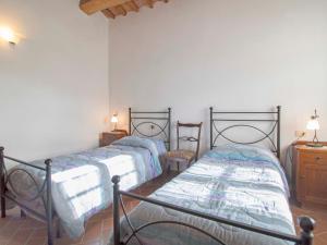 A bed or beds in a room at Apartment Papavero by Interhome