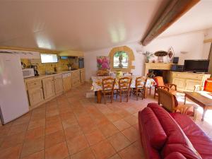 a kitchen and dining room with a table and chairs at Holiday Home Cucuron by Interhome in Cucuron