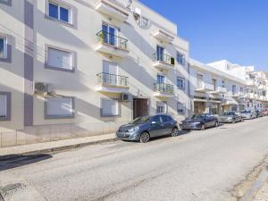 a row of cars parked in front of a building at Apartment Apartment T2 Olhão by Interhome in Olhão