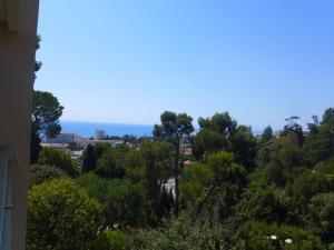 a view of the city from a hill with trees at Apartment Domaine du Clairfontaine by Interhome in Nice