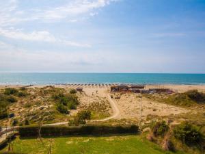 a view of a beach with the ocean in the background at Apartment Suite 48 by Interhome in Tirrenia