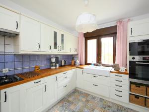 Kuchyň nebo kuchyňský kout v ubytování Holiday Home Verano by Interhome