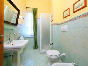 a bathroom with a toilet and a sink and a shower at Villa Paolotti by Interhome in Bettona
