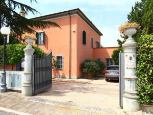 a wrought iron gate in front of a house at Villa Paolotti by Interhome in Bettona