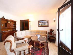 a living room with a couch and chairs and a table at Holiday Home Krumel by Interhome in Moraira