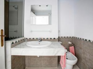 a bathroom with a sink and a toilet at Apartment Keops by Interhome in Casas Devesa +8 photos