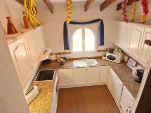 a small kitchen with a sink and a window at Villa Villa Ma-Nita by Interhome in Monte Pego