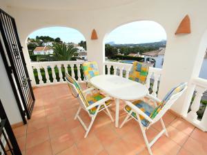 a patio with a table and chairs on a balcony at Holiday Home Pla del Mar by Interhome in Moraira