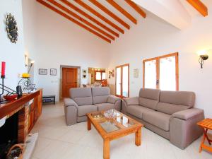 a living room with two couches and a coffee table at Holiday Home Monte y Mar by Interhome in Monte Pego