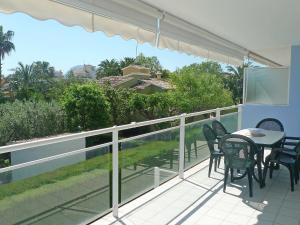 a patio with a table and chairs on a balcony at Apartment Turquesa by Interhome in Denia