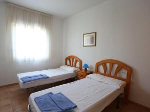 Un pat sau paturi într-o cameră la Holiday Home Zona Estival-2 by Interhome