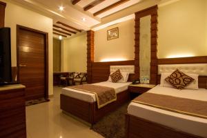 Giường trong phòng chung tại Hotel Aster Inn New Delhi