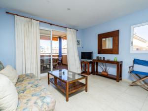 a living room with a couch and a table at Apartment Menorca-3 by Interhome in Balcon del Mar