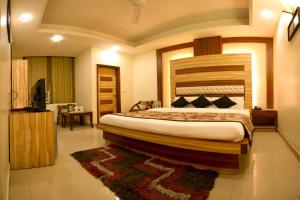 Postel nebo postele na pokoji v ubytování Hotel Aster Inn New Delhi