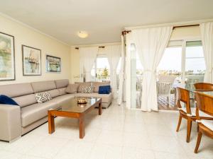 a living room with a couch and a table at Apartment Sorolla-1 by Interhome in Jávea