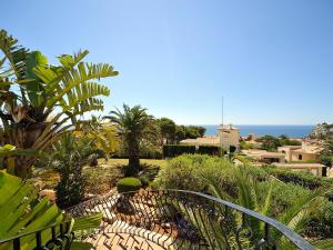 a view of a garden with plants and the ocean at Holiday Home Libertad by Interhome in Balcon del Mar