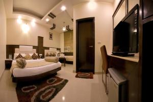 Postel nebo postele na pokoji v ubytování Hotel Aster Inn New Delhi