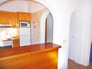 an archway in a kitchen with a wooden counter top at Holiday Home Gabi by Interhome in Monte Pego +7 photos