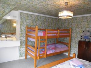 a bedroom with two bunk beds and a sink at Apartment Poperinge by Interhome in Poperinge