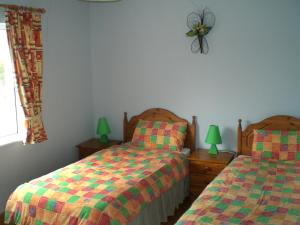 Voodi või voodid majutusasutuse Holiday Home Glenvale Cottage by Interhome toas