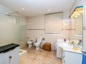 a bathroom with a toilet and a sink at Apartment Camp Nou- Travessera de les Corts by Interhome in Barcelona