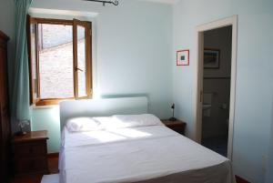 Una cama o camas en una habitación de Locanda I Piceni