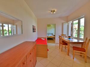 a living room with a table and a dining room at Holiday Home Franjo-2 by Interhome in Ika